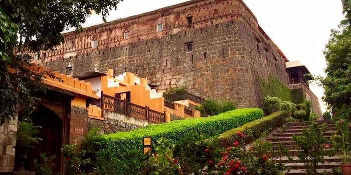 Stone ramparts and gate of Fort JadhavGadh near Pune at dusk